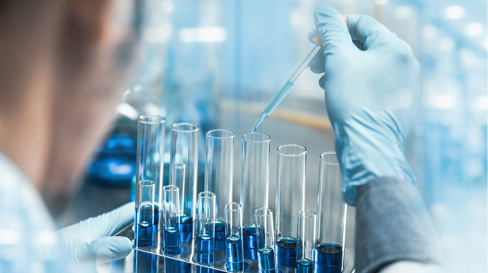 chemist using beakers